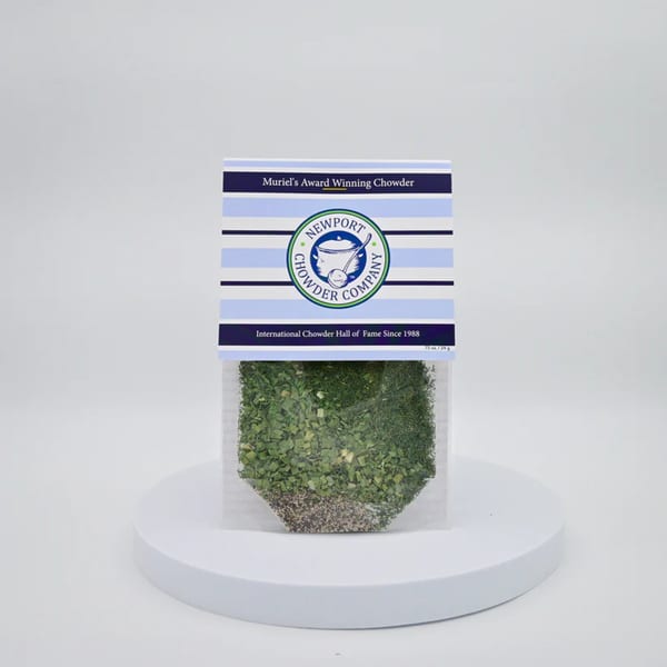 Newport Chowder Company's Muriel's Award Winning Chowder mix in a clear packet on a white stand.